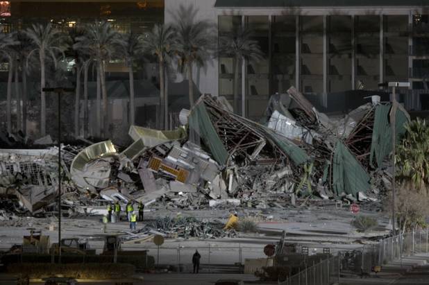 Officials look over the wreckage of the New Frontier hotel tower after it was imploded in Las Vegas, Nevada November 13, 2007. The casino on The Las Vegas Strip was purchased by Elad properties, an Israeli-owned real estate investment group, for more than U.S. $1.2 billion in May 2007. Elad Group, which also owns the Plaza hotel in New York, and the IDB Group are expected to build a Plaza-themed, multi-billion dollar megaresort on the site. 